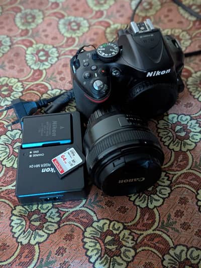 Nikon D5200 DSLR Camera + 1.8 Autofocus Lens + 64GB Card + 2 Batteries