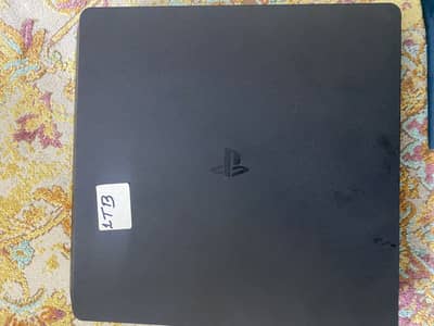 PS4 1TB.  With one controller and 4 CDs