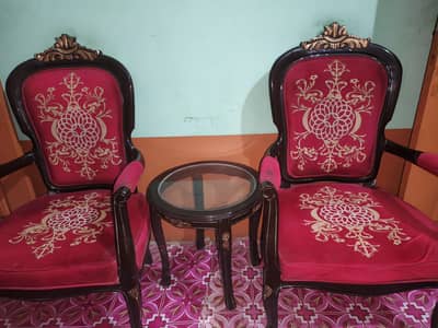 2 chairs with table
