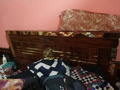 queen bed with side tables and mattress