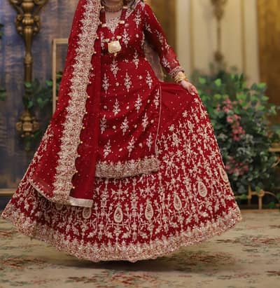 Bridal Maroon Heavily embellished Lehenga with Zardosi work