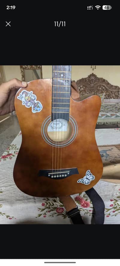 beginner acoustic guitar used but like new