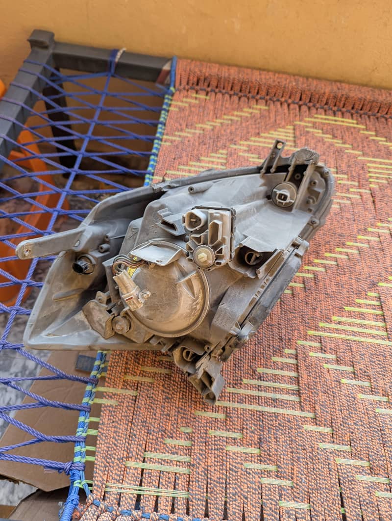 Passo 2007 left headlight 2