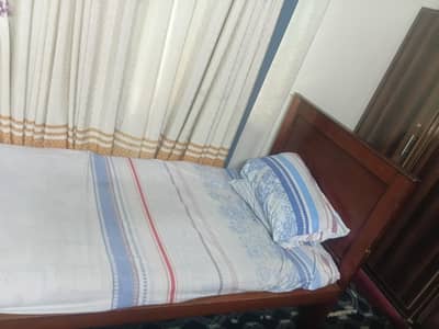 wooden single bed