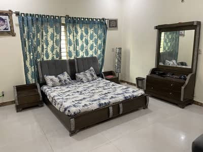 Double bed with couch with lamp dressing table with light