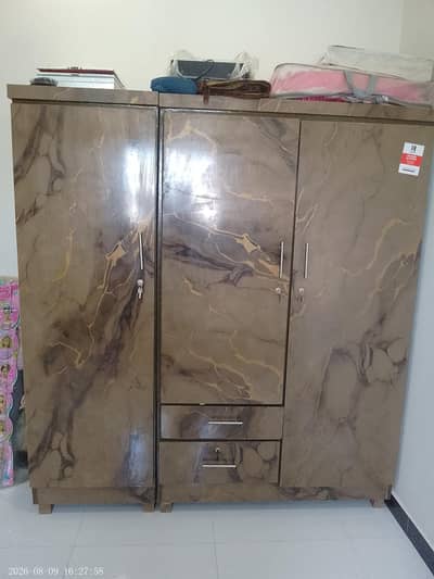 threee door cupboard