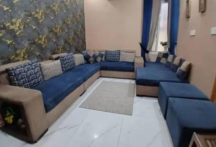 L shaped sofa set with 2 stools and a day bed