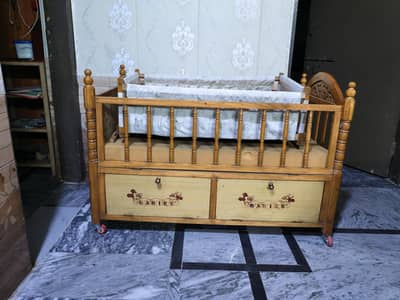 Wooden baby cot with swing cradle