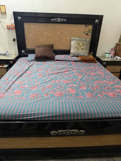 Wooden bed with side tables