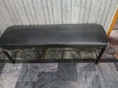2 black stools with leather poshish