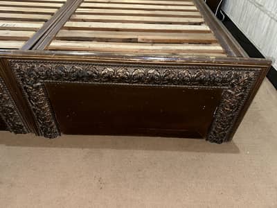 Wooden bed with side tables
