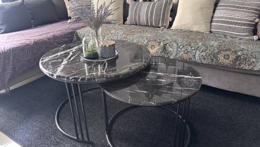 Black marble top tables pair