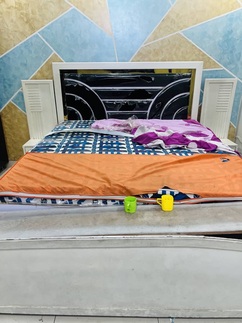 bed without mattress with side table 0