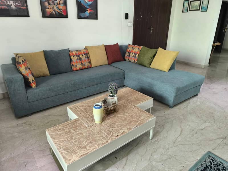 L-Shaped sofa with centre table 0
