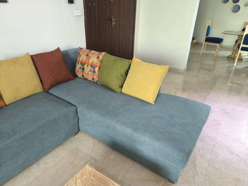 L-Shaped sofa with centre table 2