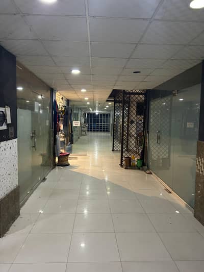 SHOP FOR RENT ADYALA TOWER, Rawalpindi. Ideal For Pharmacy, Clinic, Or Retail. Spacious Shop With Glass Door, Bright Lighting, On Main Road With Parking. Rs. 20,000/Month.