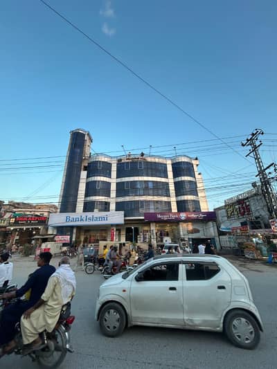 SHOP FOR RENT ADYALA TOWER, Rawalpindi. Ideal For Pharmacy, Clinic, Or Retail. Spacious Shop With Glass Door, Bright Lighting, On Main Road With Parking. CCTV-Enabled, Rs. 20,000/Month.