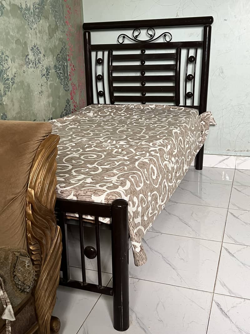 Two single iron beds 2