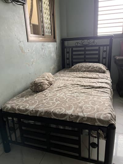 Two iron beds