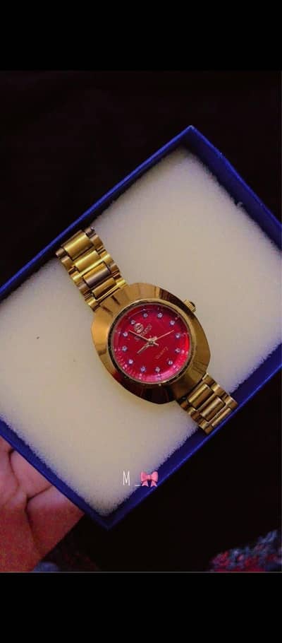 sheraton womens golden watch with red dial