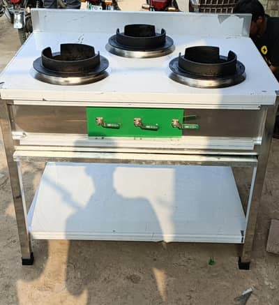 dough mixer, prep table, pizza oven, hot plate, delivery bags, stoves