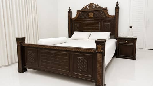 wooden king size heavy bed .