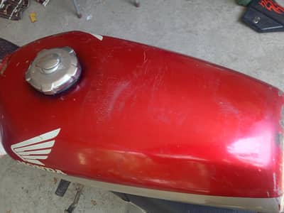 Honda 125 ke Tani ha 2 Hain ak full ok h ak thori ruf h shamsabad rwp