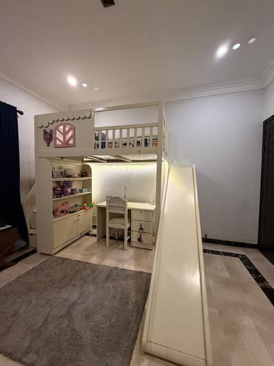 Kids bunkbed with slide, drawers on stairs, study table and LED lights