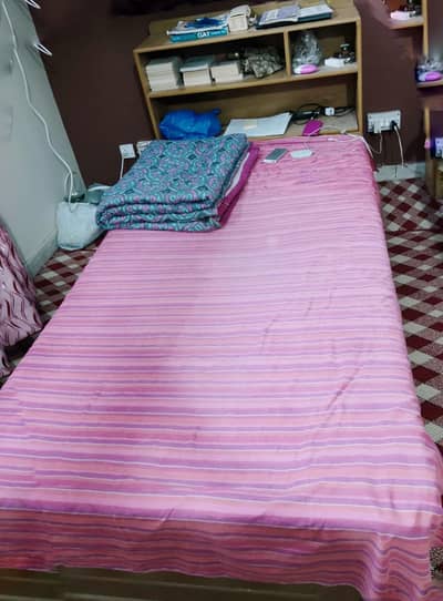 Single bed with shelves and a drawer