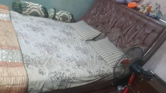wooden bed with side tables