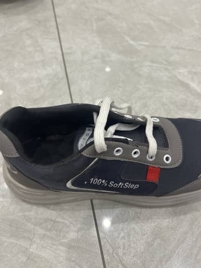 Dark blue shoes with white laces