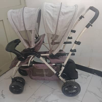Twin branded pram for sale