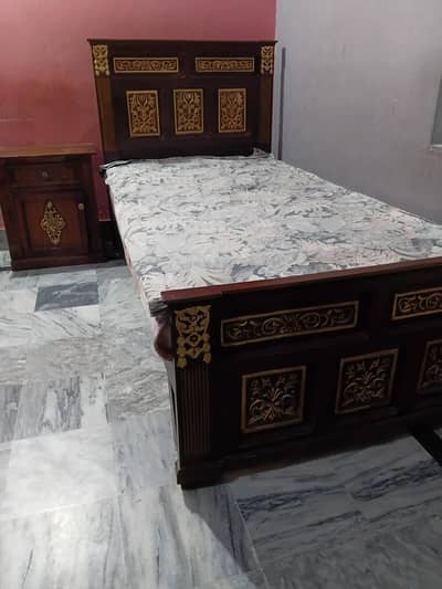 wooden single bed with side table