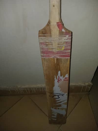 a tennis ball cricket bat signed by famous cricketer saim ayub