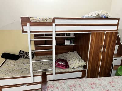 Kids triple bunker bed with attached almari and separate stairs