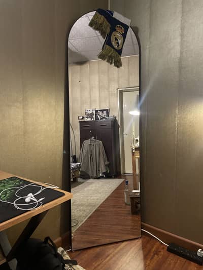 Large standing mirror.