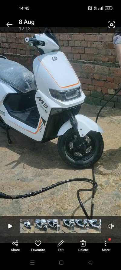 10 days used electric scooty 1000 wat model power 10 by 10 condition