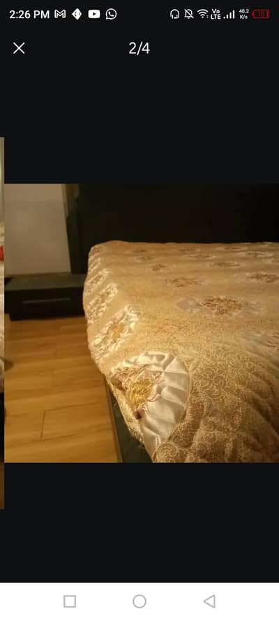 Queen bed with 2 bed side tables and mattress.