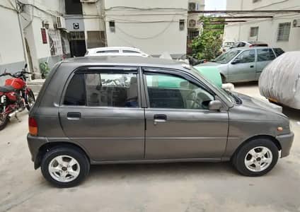 Daihatsu Cuore 2011 CX ECO. Grey. Call 0312-2650870