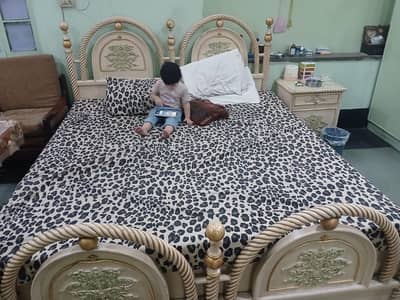 wooden bed with 2 side tables and and dressing tables