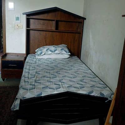 single bed set wth 1 side table nd 1 cupboard