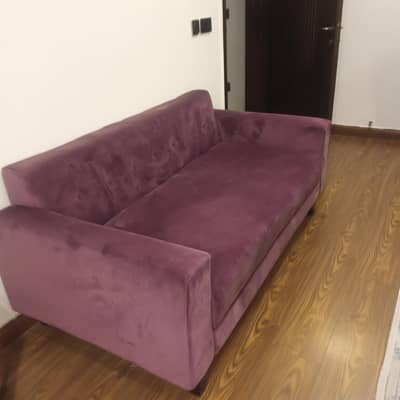 2 seater sofa with 6 multi colored cushions for sale
