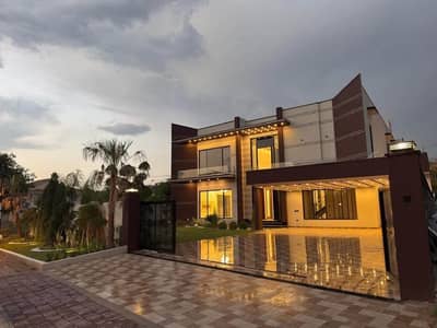 2.5 Kanal Ultra-Luxury Modern Designer House | 6 Bedrooms | 2 Swimming Pools | Home Cinema | Solar System | Beautiful Front & Back Lawns