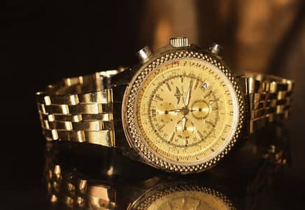Elegant gold tone chronograph style wrist watch pre-owned