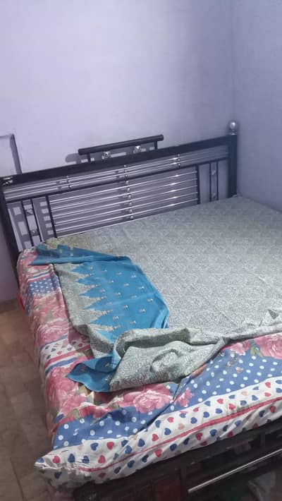 king bed and iron bed