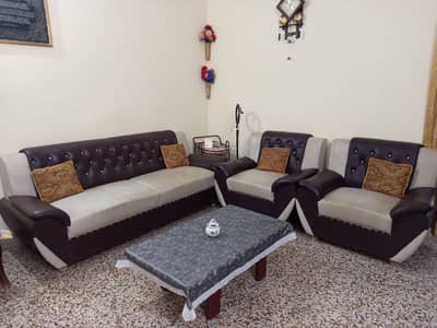 sofa set and table with cushions in excellent condition