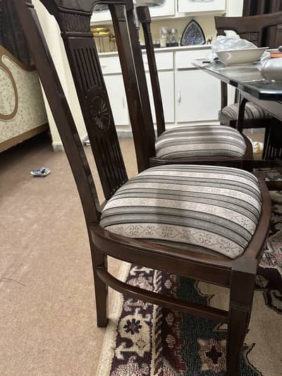 8 chairs alongwith glass top dining table