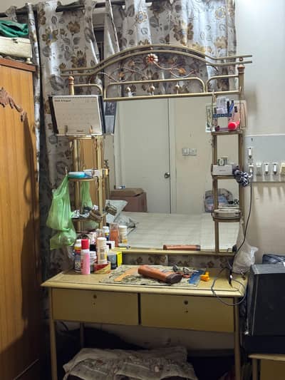 iron bed with two side tables and dressing