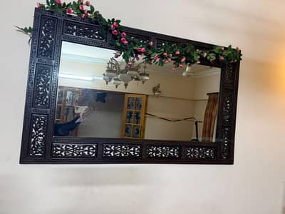 a big carven mirror