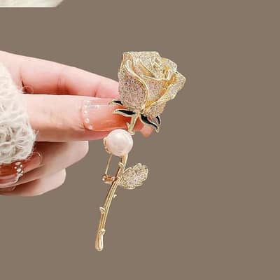 gold plated brooch with diamond and pearl accent